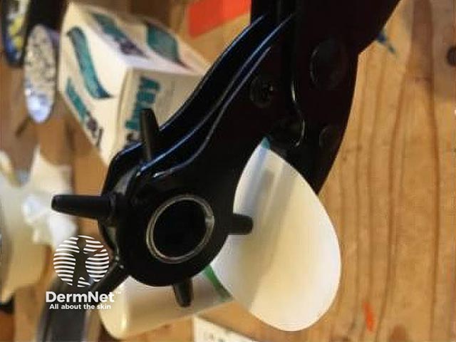 A hole punch can be used to create a hole to allow  the continuous monitor probe to enter the skin