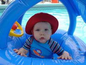 Toddler in shaded pool float